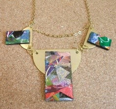 Collage on brass necklace by Anthea Louise Piszczuk